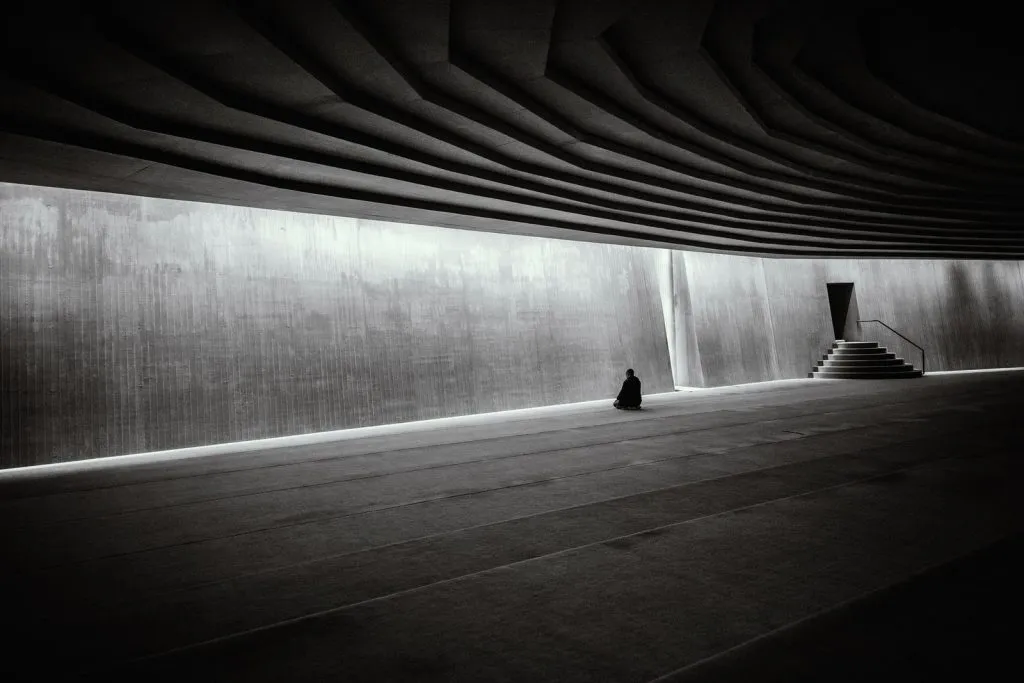 Silhouette of Person Near Wall